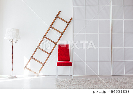 lamp staircase red chair in the interior of the white room 64651853