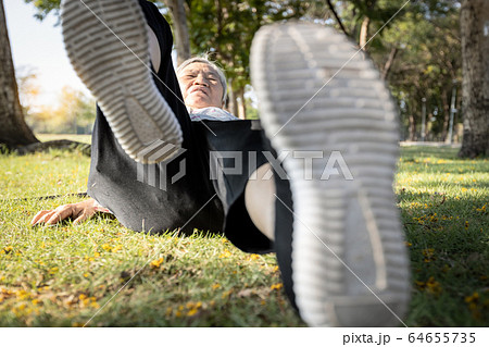 Senior woman slipped down,fell on the ground,old people who suffered an accident,injury in the back,butt pain,bone fracture,falling down to the floor,body balance problem while walking of the elderly  64655735