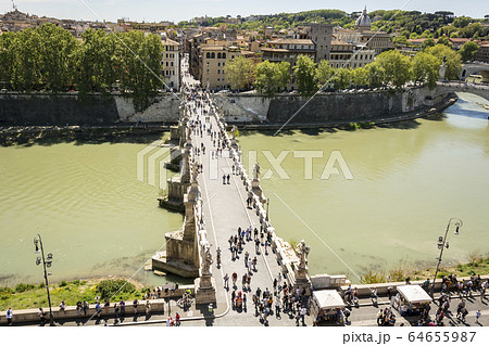 people walking on the bridge 64655987