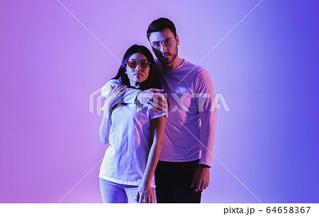 European man and asian woman in fashion glasses 64658367