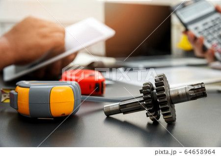 Close Up mechanical gear parts on office desk. 64658964