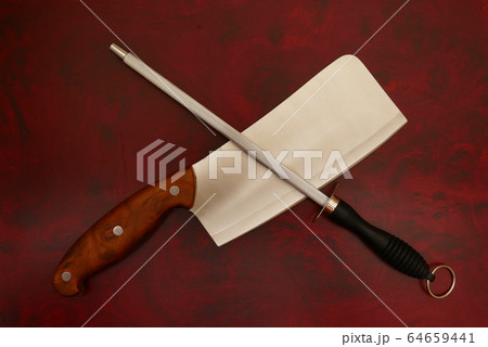 Knife and Sharpener On A Cutting Board Knife and Sharpener On A Cutting Board 64659441