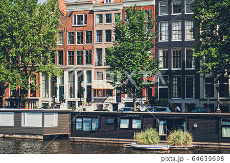 Main downtown street in the city center of Amsterdam in Netherlands Main downtown street in the city center of Amsterdam in Netherlands 64659698