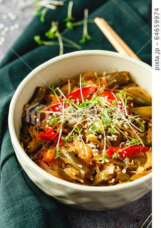 Noodles and green beans. 64659974