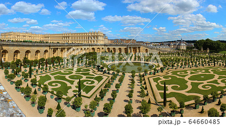 Versailles Palace exterior near Paris, France. This view shows the Orangerie with citrus fruit trees. 64660485