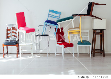 lots of multicolored chairs in the interior of the white room lots of multicolored chairs in the interior of the white room 64661596