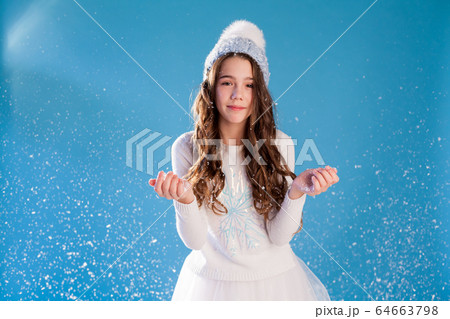 Beautiful girl in winter cap snow chill January Beautiful girl in winter cap snow chill January 64663798