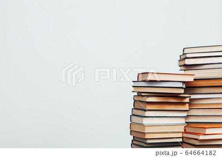 a lot of stacks of educational books in the library on a white background 64664182