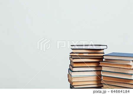 a lot of stacks of educational books in the library on a white background 64664184