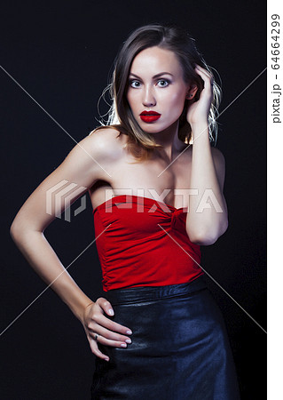 young lady posing emotional on black background, lifestyle people concept young lady posing emotional on black background, lifestyle people concept 64664299