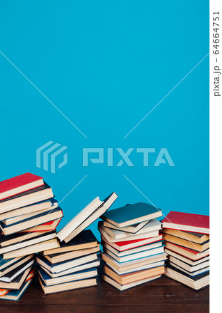 many stacks of educational books for learning preparation for college exams on a blue background many stacks of educational books for learning preparation for college exams on a blue background 64664751