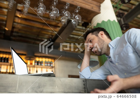 Restaurant, cafe, bar closed due to COVID-19 or Coronavirus outbreak lockdown, stressed owner of small business trying to find solution 64666508