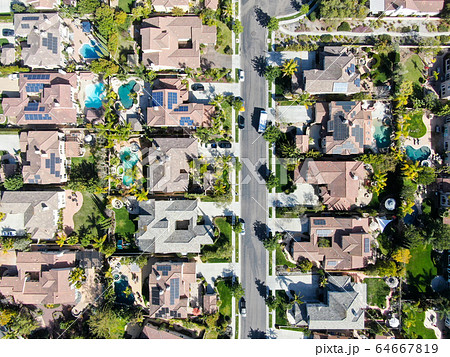 Aerial view suburban neighborhood with identical villas next to each other. San Diego, California 64667819