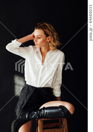 Portrait of a beautiful fashionable stylish woman in clothes poses Portrait of a beautiful fashionable stylish woman in clothes poses 64668033