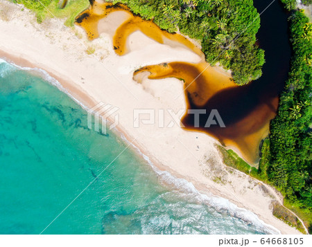 Aerial top view of river merging to tropical white sand beach and turquoise clear sea water ocean 64668105