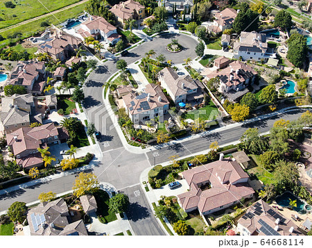 Aerial view suburban neighborhood with identical villas next to each other. San Diego, California 64668114