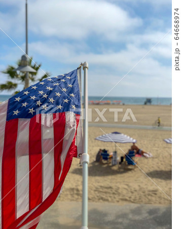 American flag with the beach on the background American flag with the beach on the background 64668974