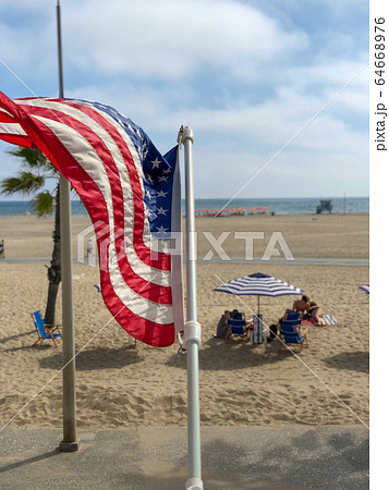 American flag with the beach on the background American flag with the beach on the background 64668976