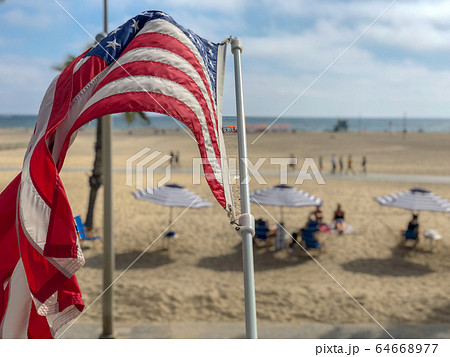American flag with the beach on the background American flag with the beach on the background 64668977