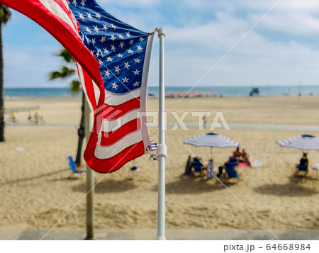 American flag with the beach on the background American flag with the beach on the background 64668984