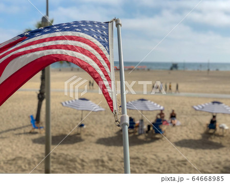 American flag with the beach on the background 64668985