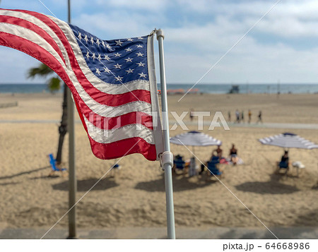 American flag with the beach on the background 64668986