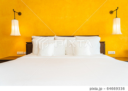 White pillow on bed decoration interior of bedroom White pillow on bed decoration interior of bedroom 64669336