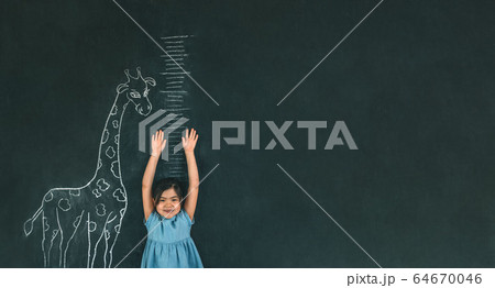 Child measures height Child measures height 64670046