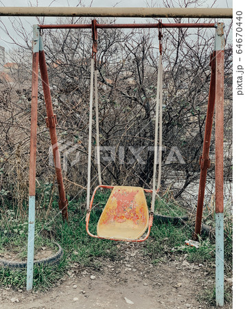 Old vintage rusty baby swing nobody park 64670440