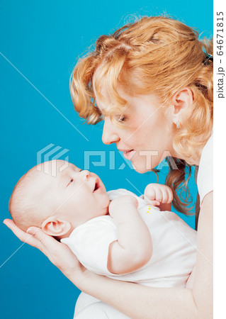 Portrait of a mother with a baby in her arms her son Portrait of a mother with a baby in her arms her son 64671815
