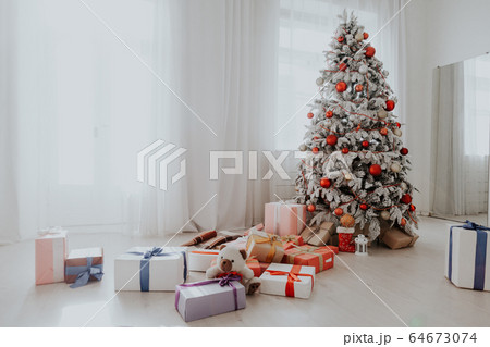 Christmas home tree with garlands of lights new year white winter Christmas home tree with garlands of lights new year white winter 64673074