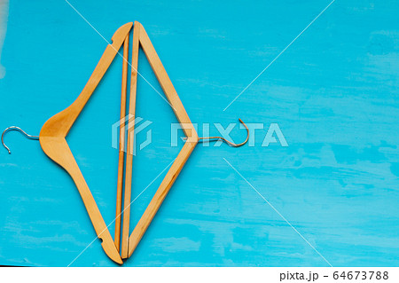 old wooden hangers for things on the table background old wooden hangers for things on the table background 64673788