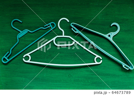 many hangers for clothes on the background many hangers for clothes on the background 64673789