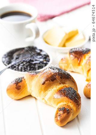 Sweet homemade croissants with poppy. Sweet homemade croissants with poppy. 64674514