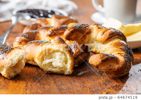 Sweet homemade croissants with poppy. Sweet homemade croissants with poppy. 64674519