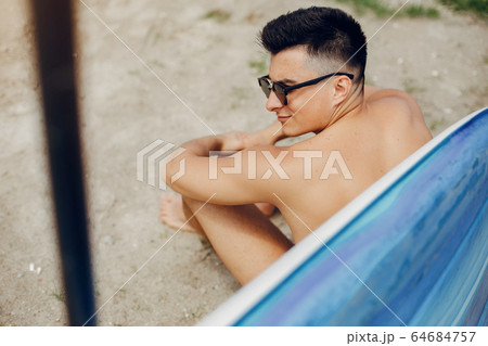 Sup surfer on a summer beach Sup surfer on a summer beach 64684757