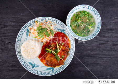 Roast, stewed in tomato sauce, served with rice and fresh salad with broth 64686106