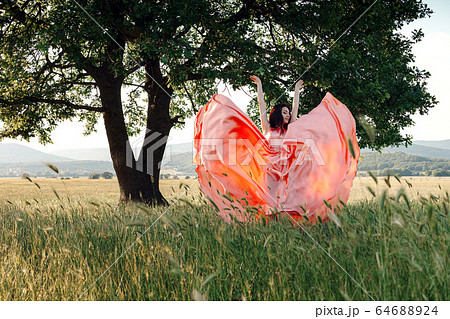 Beautiful Active Free Girl on Summer Green Outdoor 64688924