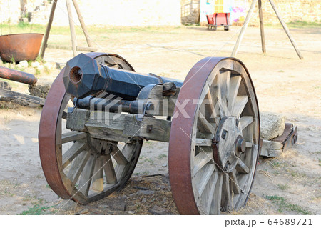 An old cannon on wheels An old cannon on wheels 64689721