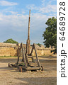 Trebuchet. Old wooden catapult 64689728