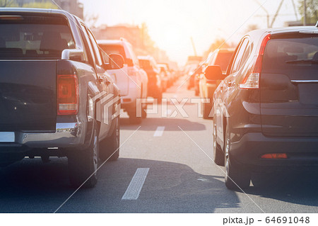 Evening traffic jam on busy city highway. Rows of car stck on road due to crush accident. Sunset metropolis rush hour scene 64691048