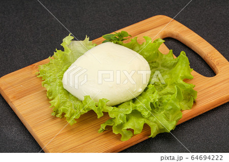 Italian Mozzarella cheese over board 64694222