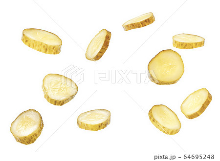 Flying pickled cucumber slices isolated on a white Flying pickled cucumber slices isolated on a white 64695248