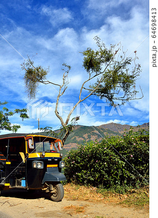 Rickshaw standing on village road in India 64698413