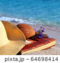 Vintage photo album on the beach 64698414