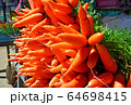 Bunch of ripe carrots in the market 64698415