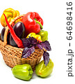 Ripe vegetables in the basket isolated on white 64698416
