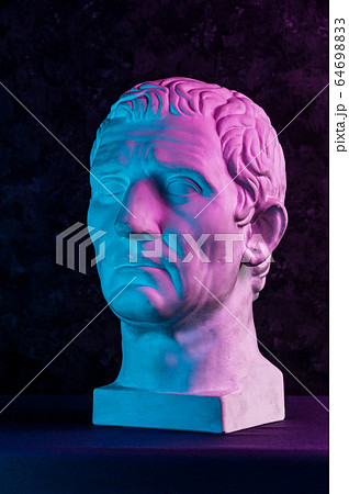 Statue of Guy Julius Caesar Octavian Augustus. Creative concept colorful neon image with ancient roman sculpture Guy Julius Caesar Octavian Augustus head. Cyberpunk, vaporwave and surreal art style. 64698833