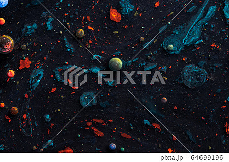 Amazing multi colored bubbles of paint on the oil surface. 64699196