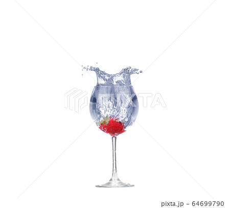 Strawberry splash in a cocktail glass on white 64699790